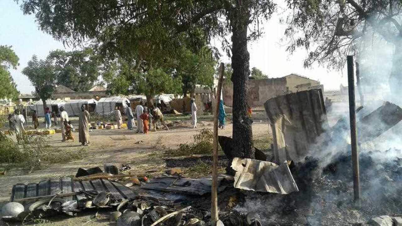 Smoke rises from a burnt out shelter at a camp for displaced people in Rann, Nigeria, Tuesday Jan. 17,