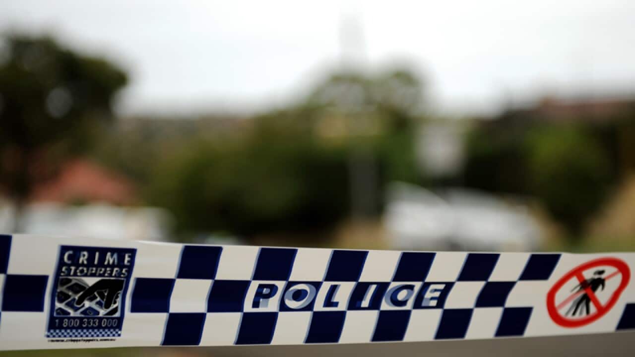 Police tape restricts access to a street in Sydney