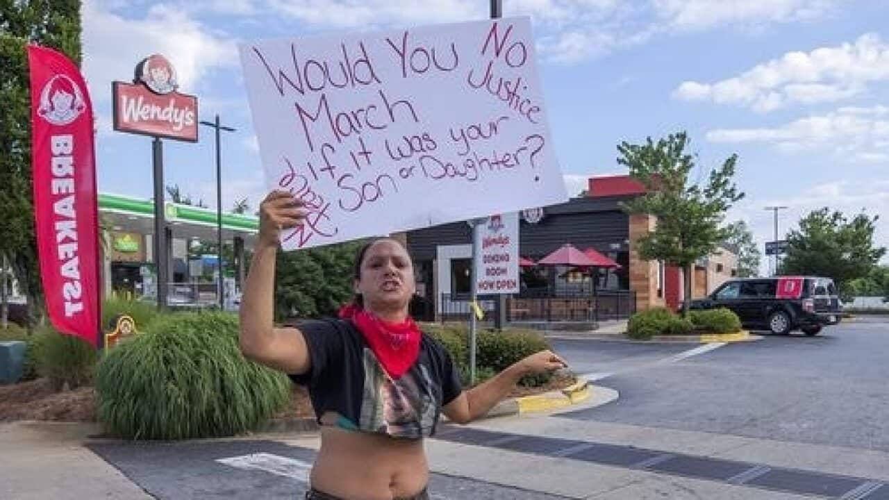 People have protested the fatal shooting by police of a man at a Wendy's restaurant in the US.