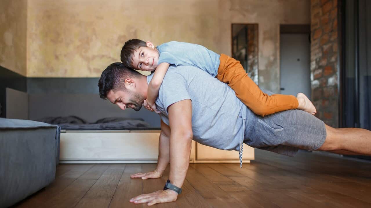 Father and son playing at home