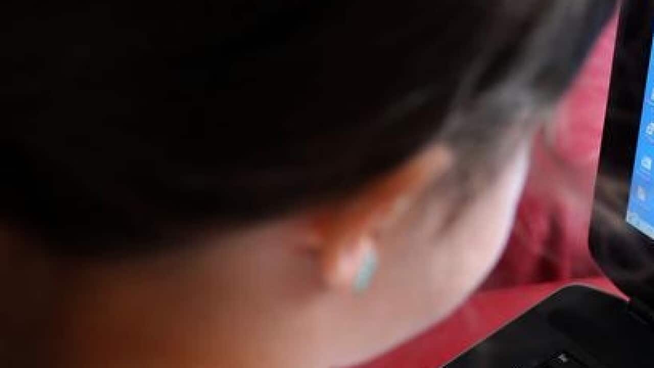 FIle photo of child using a laptop