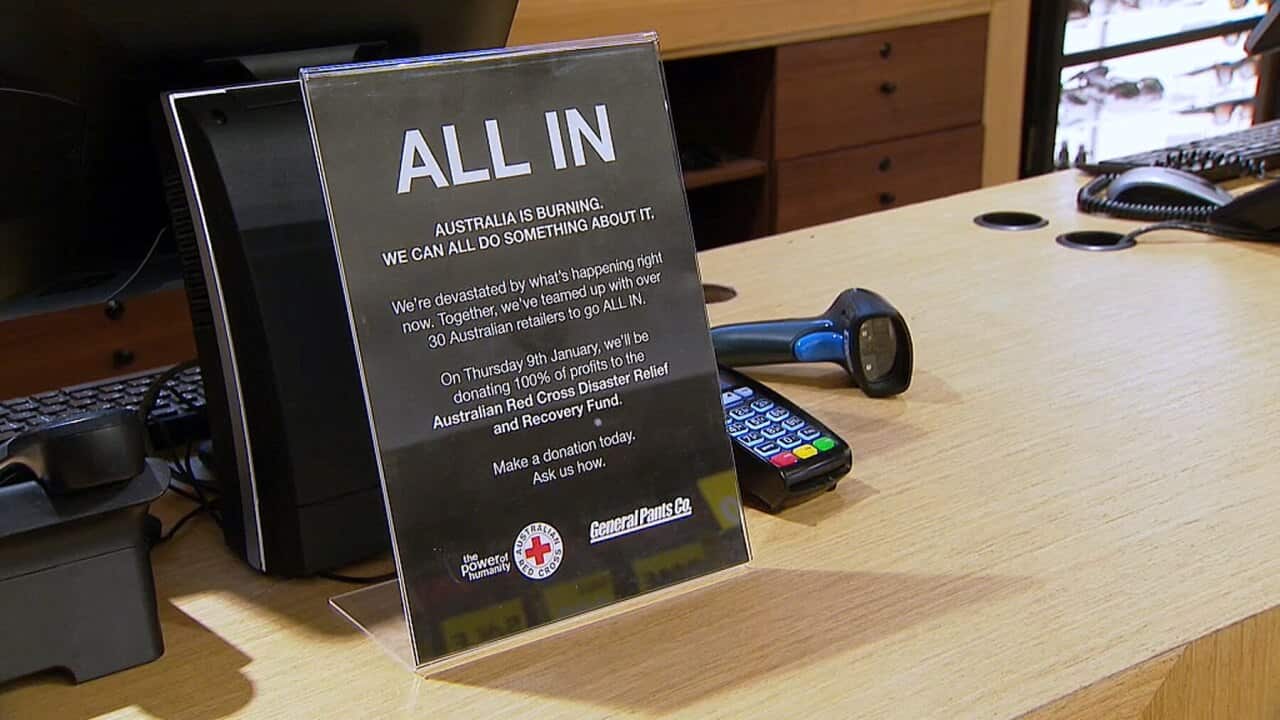 A sign at the till at a General Pants store about their support for bushfire victims
