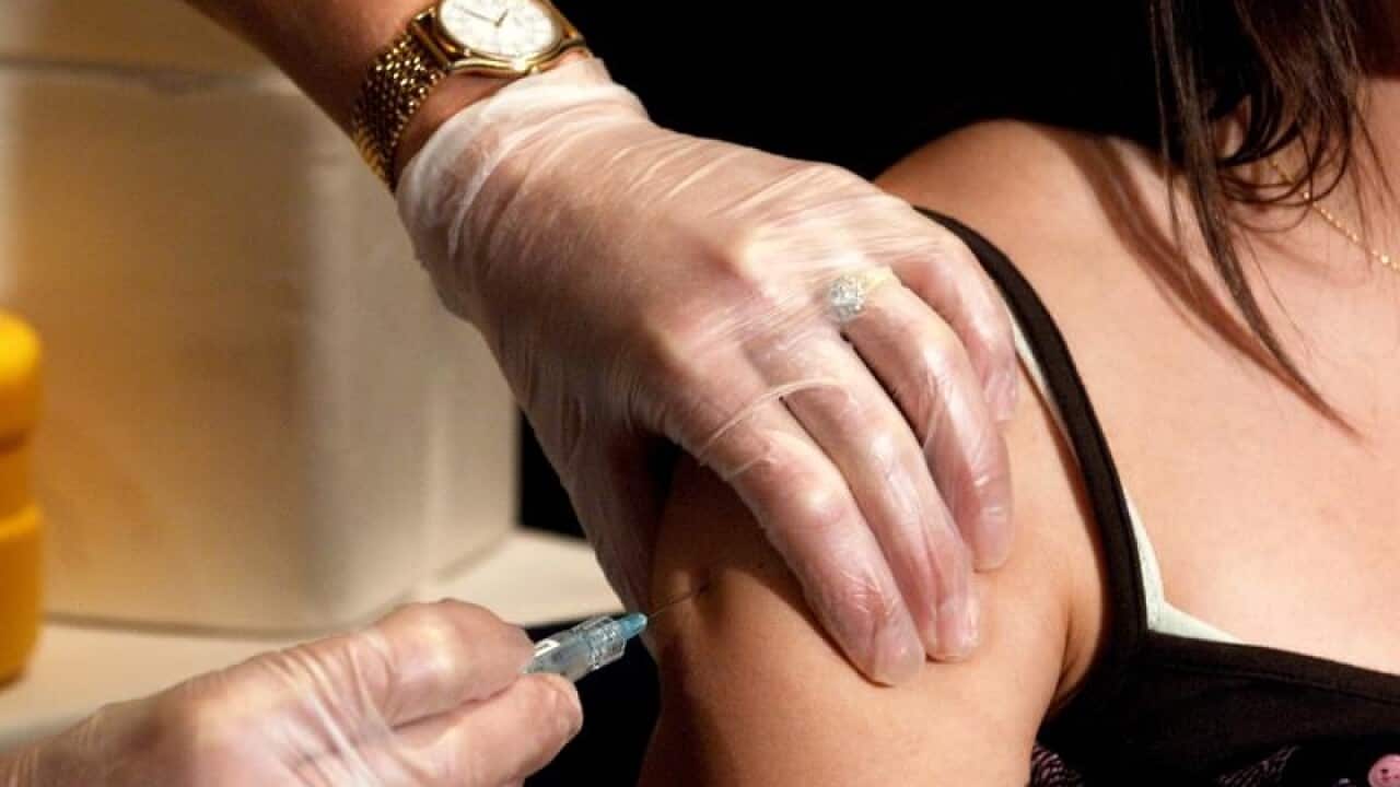 A cervical cancer vaccine is injected