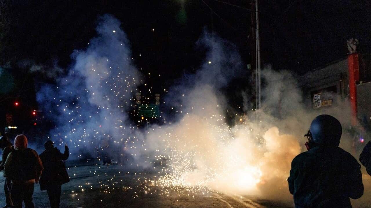 ICE agents unleash tear gas and flash bang grenades during protests over the killing of Alex Pretti (AAP).jpg