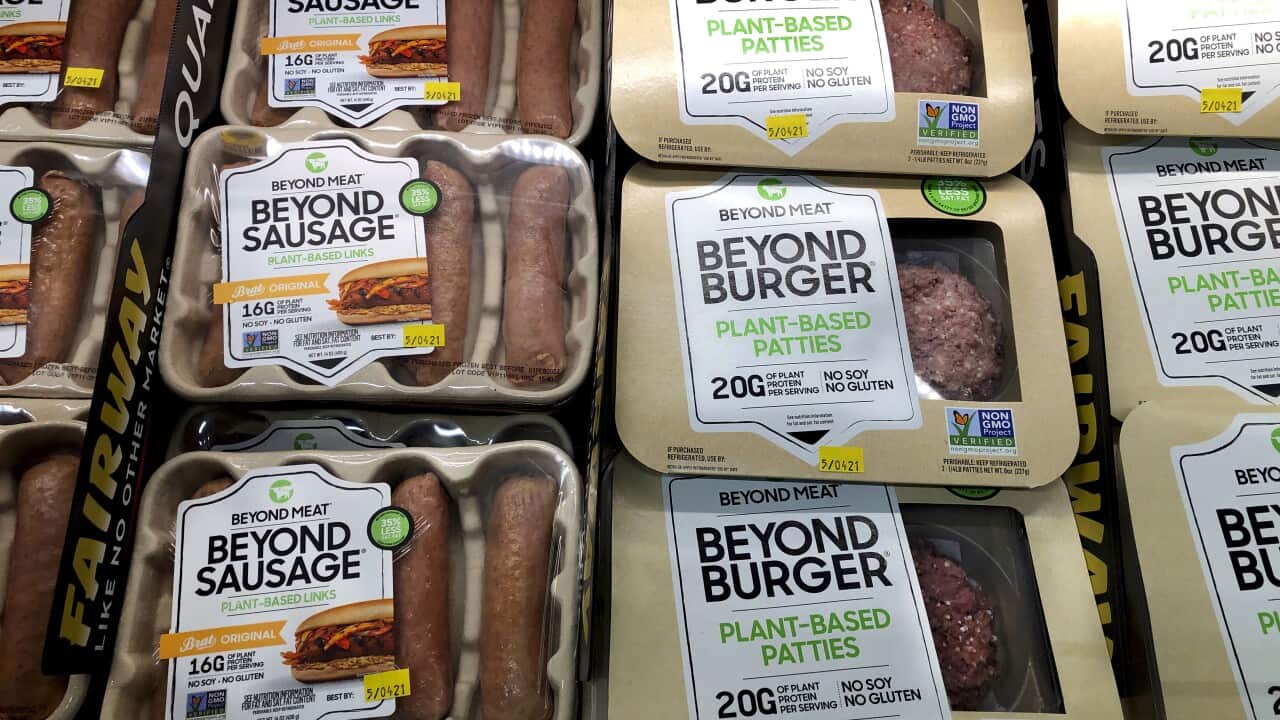 Packages of plant-based sausages and patties, labelled 'Beyond Meat Beyond Sausage' and 'Beyond Burger Plant-Based Patties'