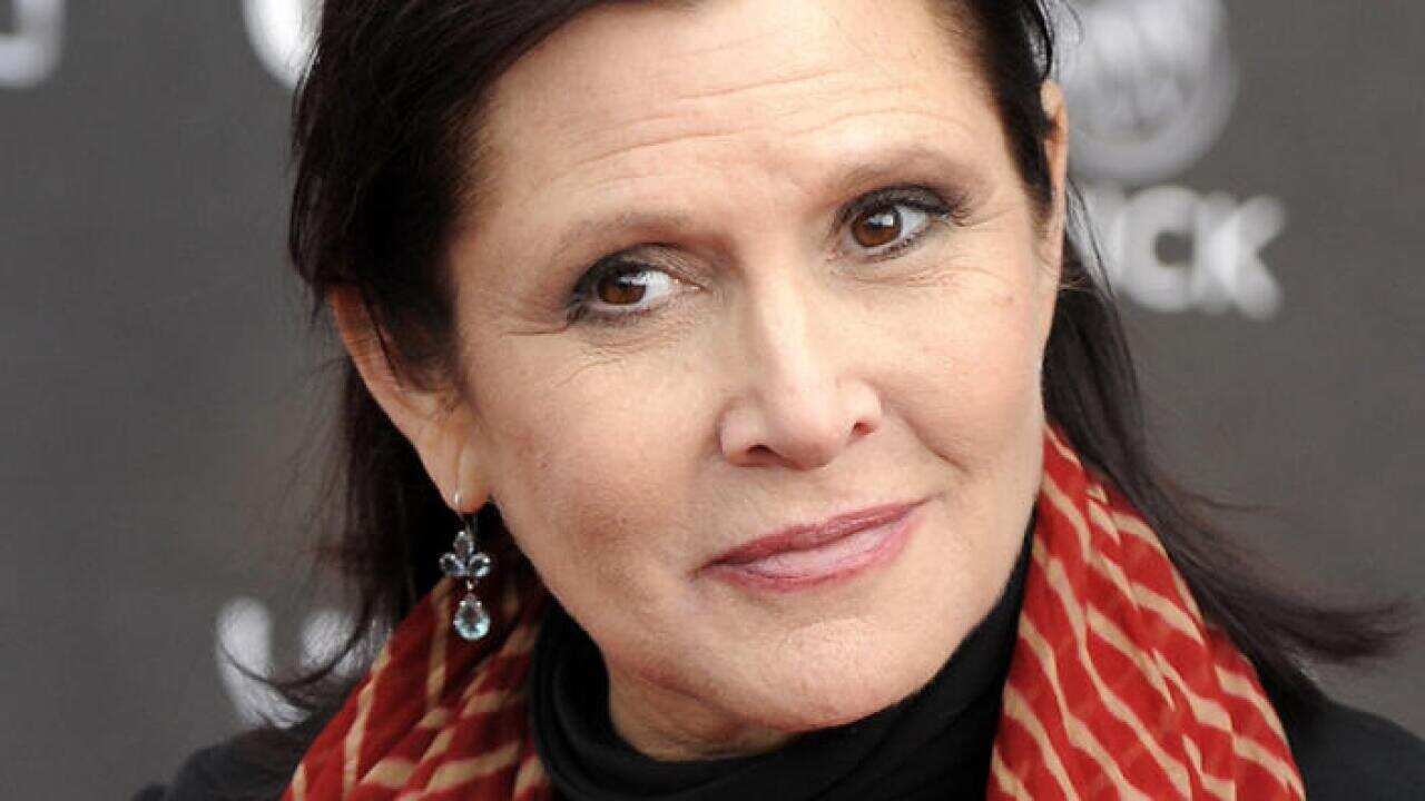 FILE - In this Thursday, April 7, 2011 file photo, Carrie Fisher arrives at the 2011 NewNowNext Awards in Los Angeles. On Tuesday, Dec. 27, 2016, a publicist said Fisher has died at the age of 60. (AP Photo/Chris Pizzello, File)