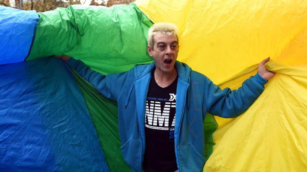 A demonstrator takes part in a marriage equality rally