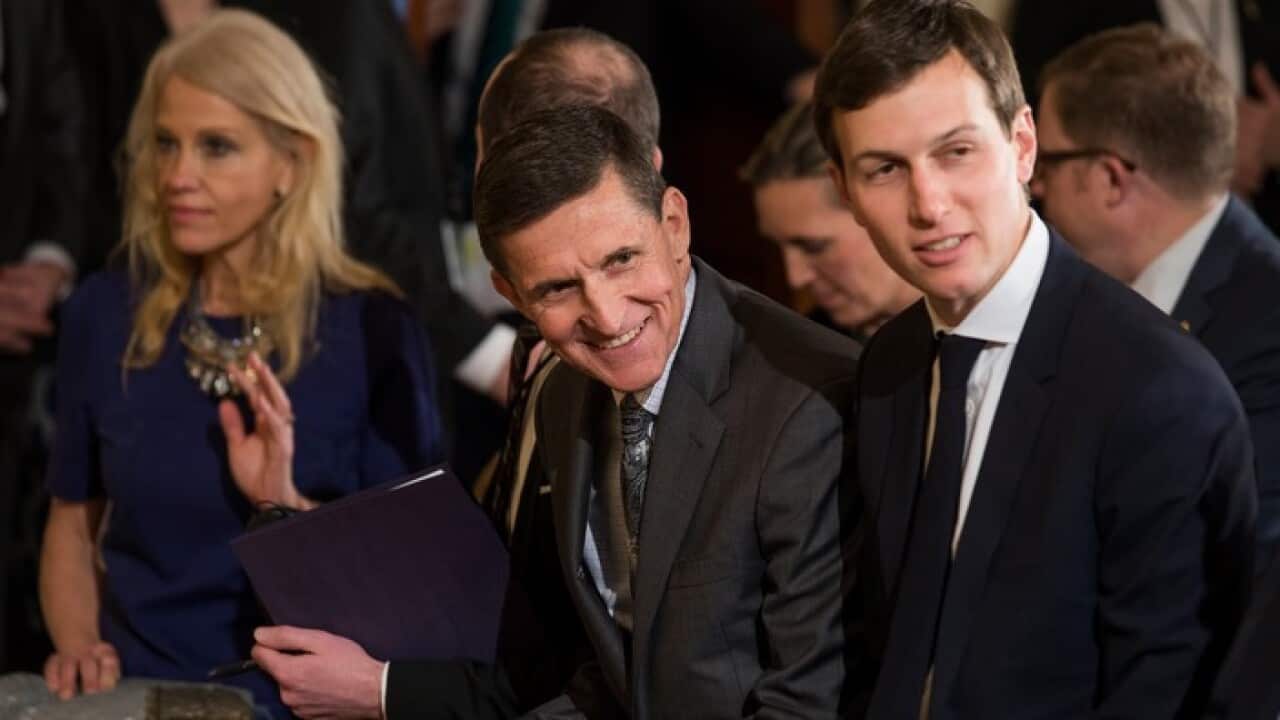 Embattled National Security Advisor Michael Flynn (C) flanked by Kellyanne Conway (L) and Jared Kushner (R) attends a press conference