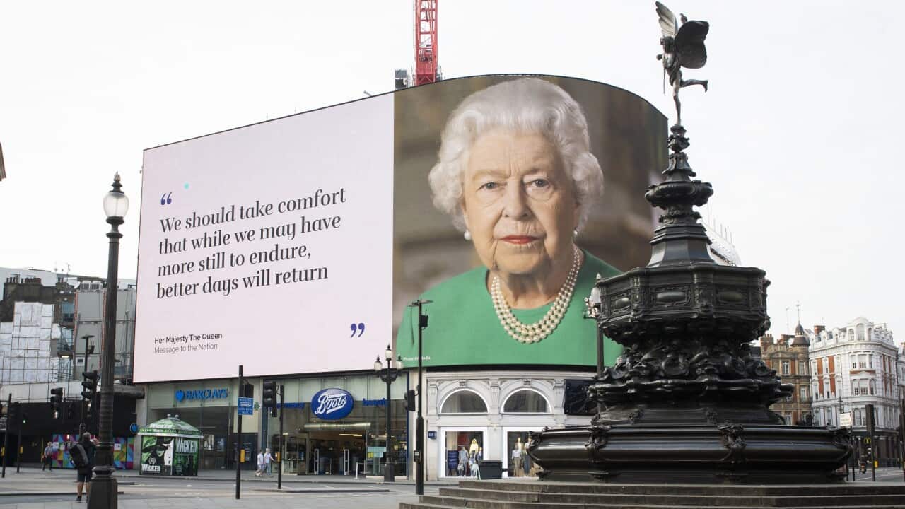 An image of the Queen overlooks a deserted Piccadilly Circus in London