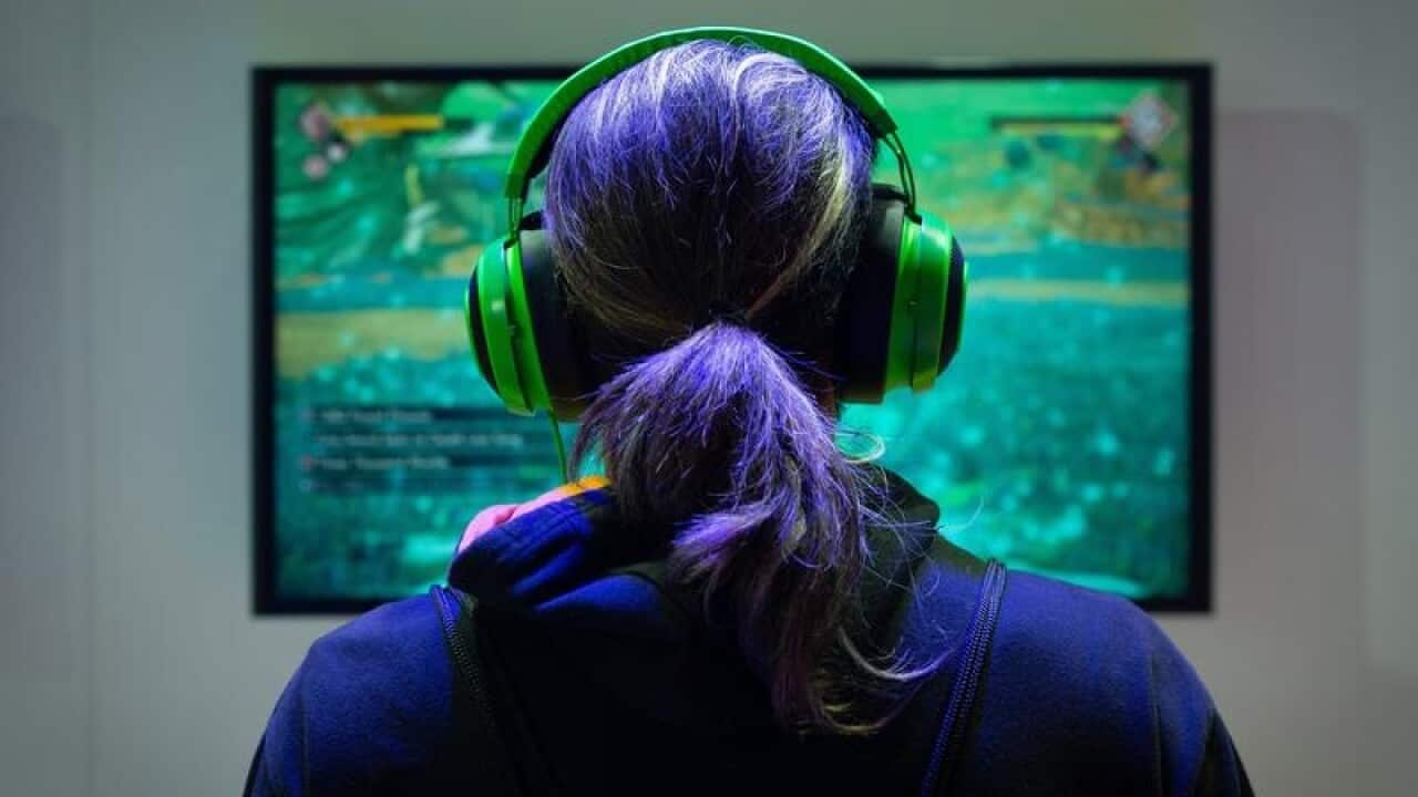 A visitor plays a video game.