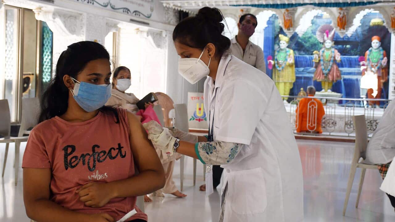 A beneficiary gets a dose of COVID vaccine during the third phase of the Covid-19 vaccination drive