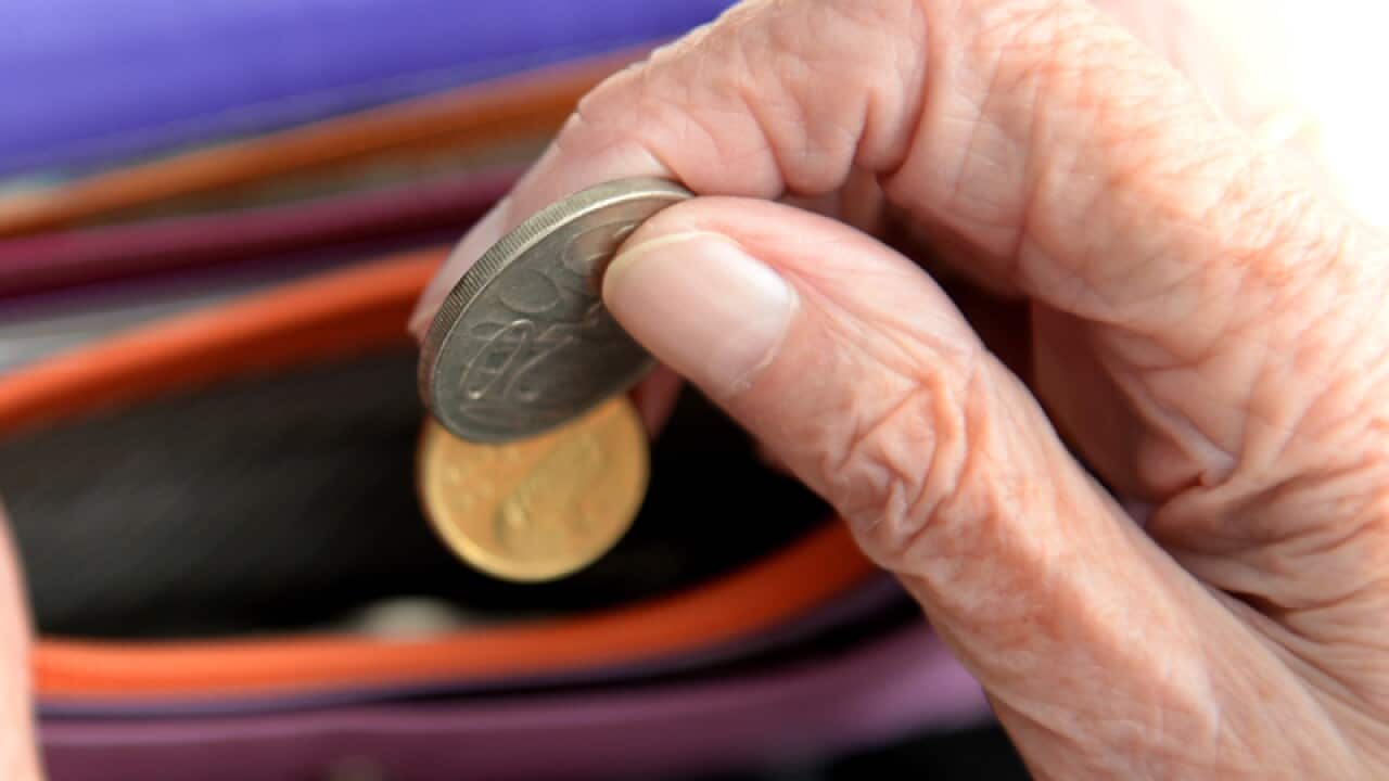 Money is taken out of a purse Canberra