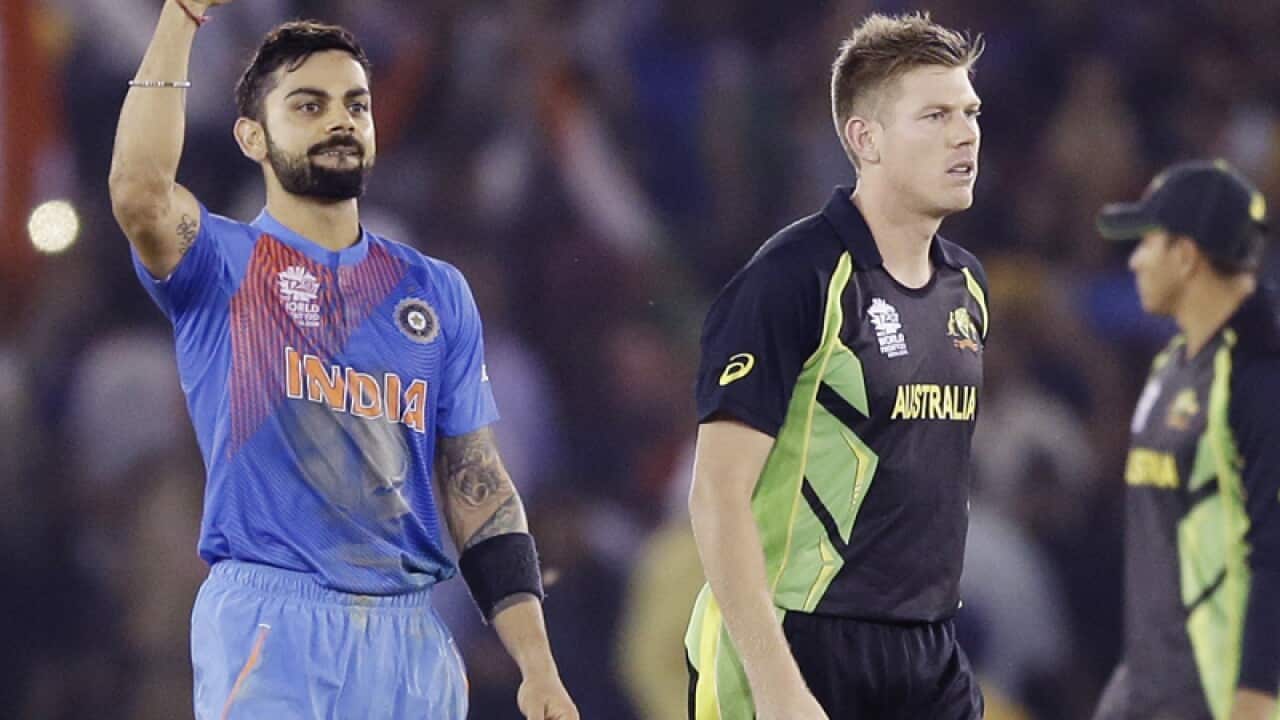 India's Virat Kohli, left, celebrates