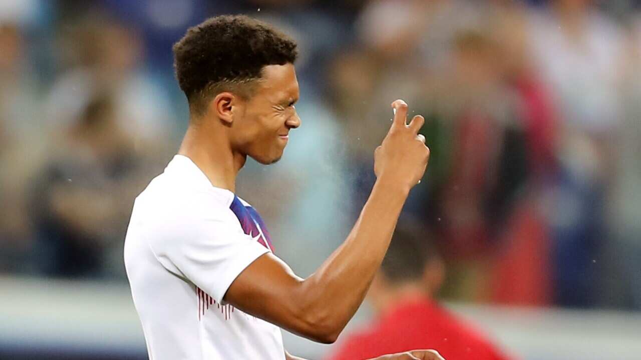 England's Trent Alexander-Arnold sprats insect repellent before the FIFA World Cup Group G match at The Volgograd Arena