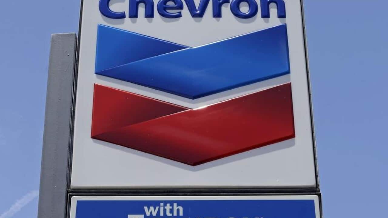 A Chevron sign at a gas station