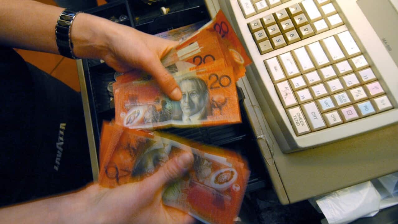 Money removed from a till Canberra, Thursday, July 12, 2007. (AAP Image/Alan Porritt) NO ARCHIVING