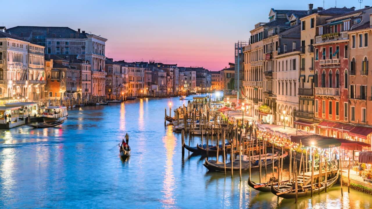 Gondolier Heads into the Sunset Along Venice's Grand Canal (Sunset)