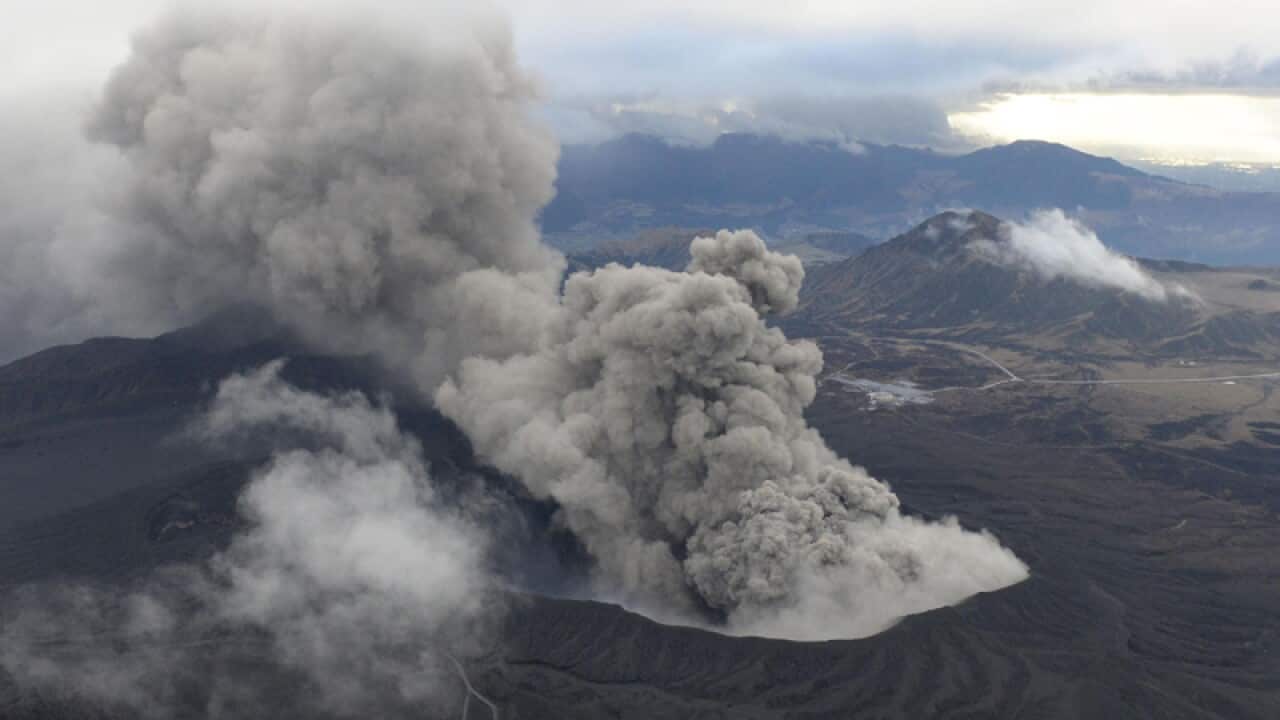 Volcanic smoke billows from Mount Aso