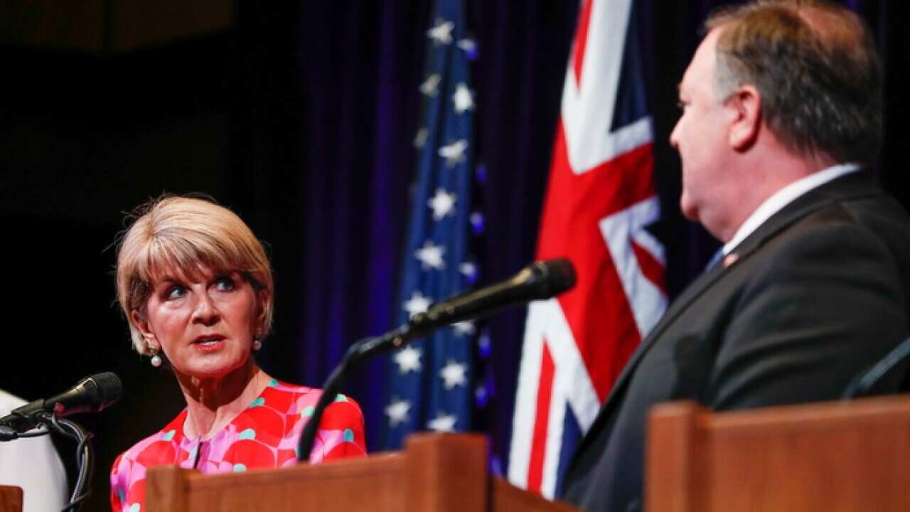 Julie Bishop looks to Mike Pompeo at a news conference