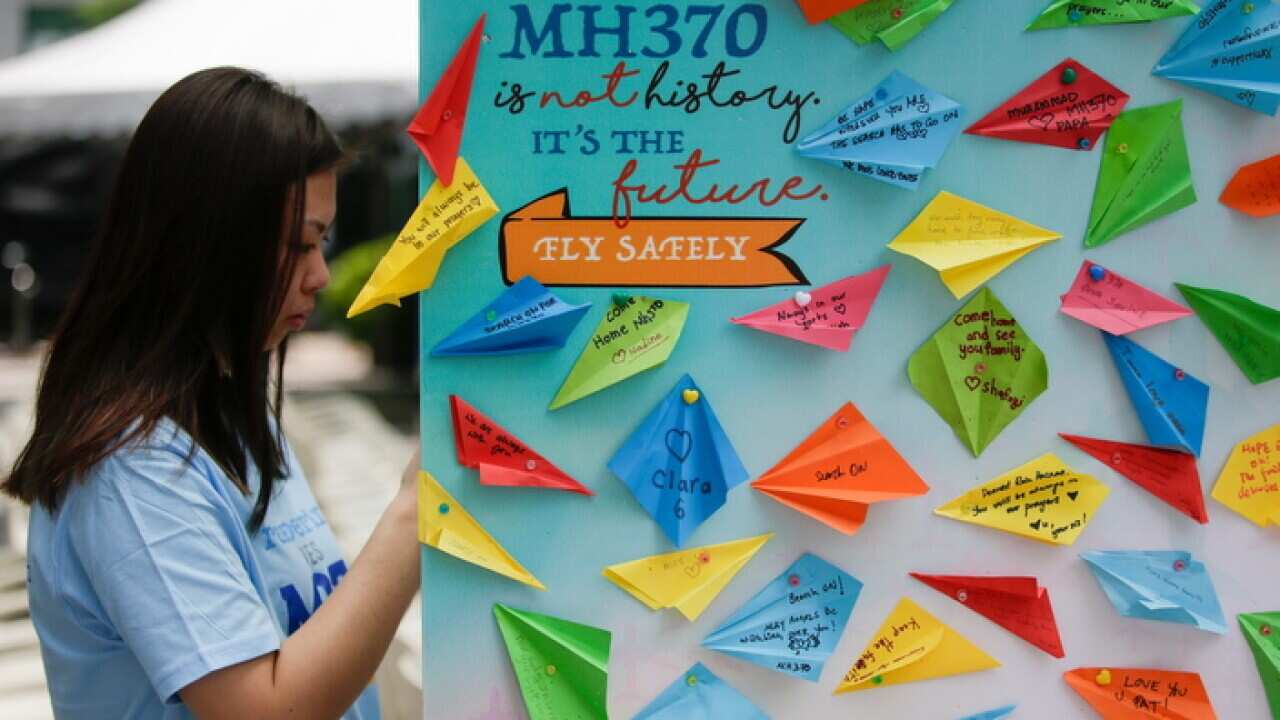 Messages written on paper planes are displayed during a ceremony to mark fifth anniversary of flight MH370's disappearance