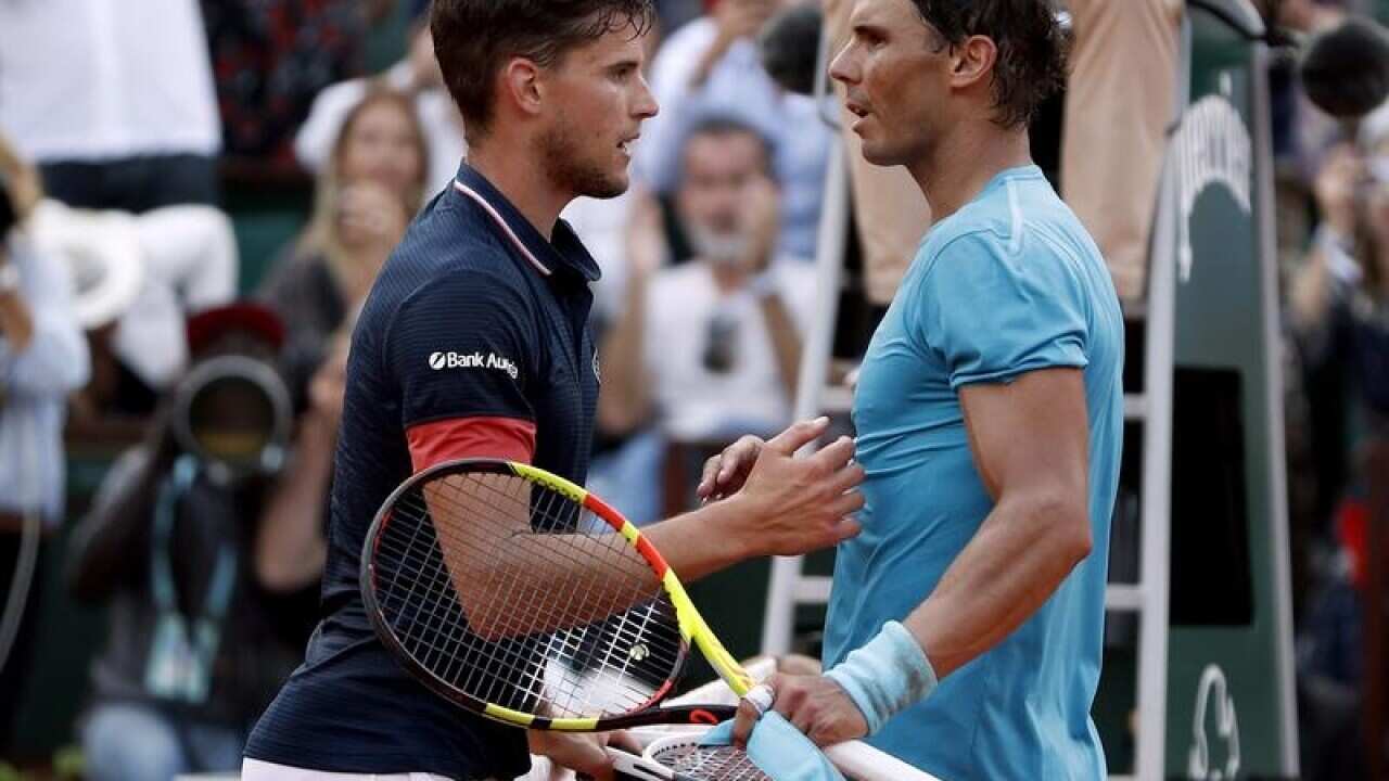 Dominic Thiem congratulates Rafael Nadal.