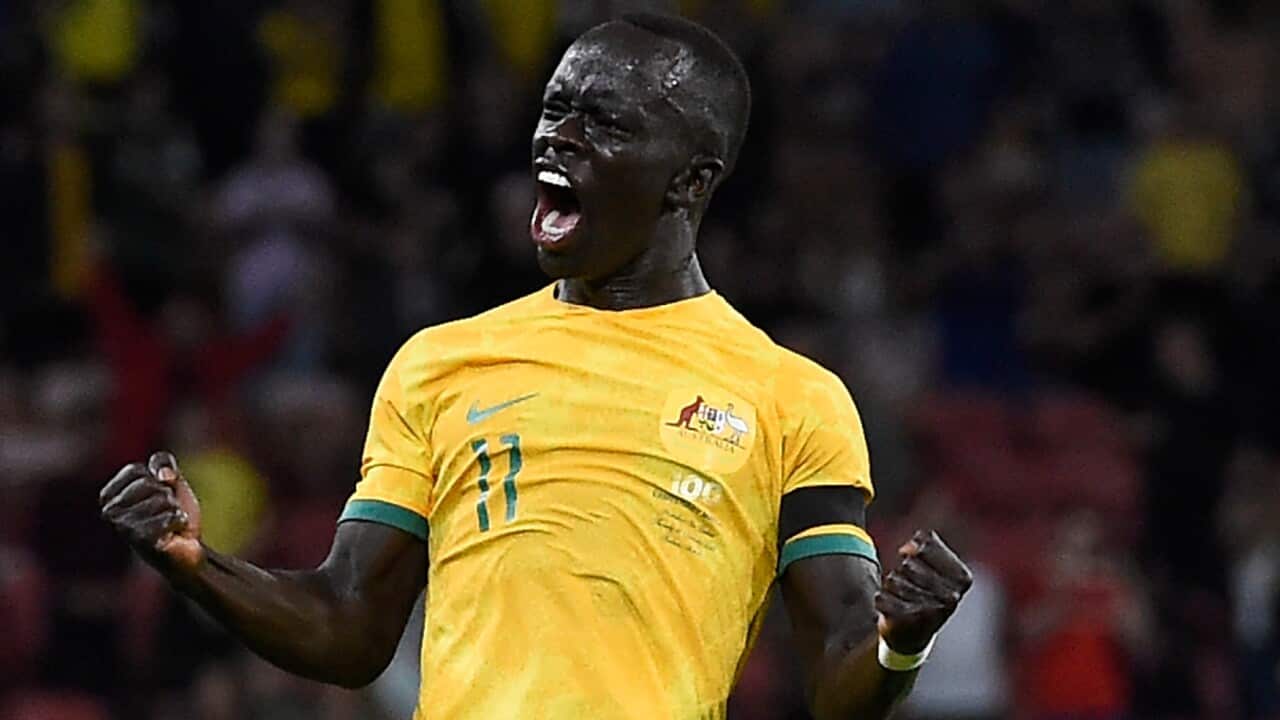 Awer Mabil celebrates a goal for the Socceroos