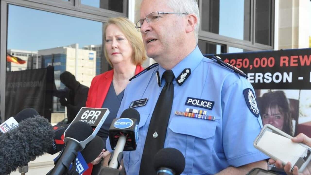 Police Commissioner Chris Dawson is seen addressing the media