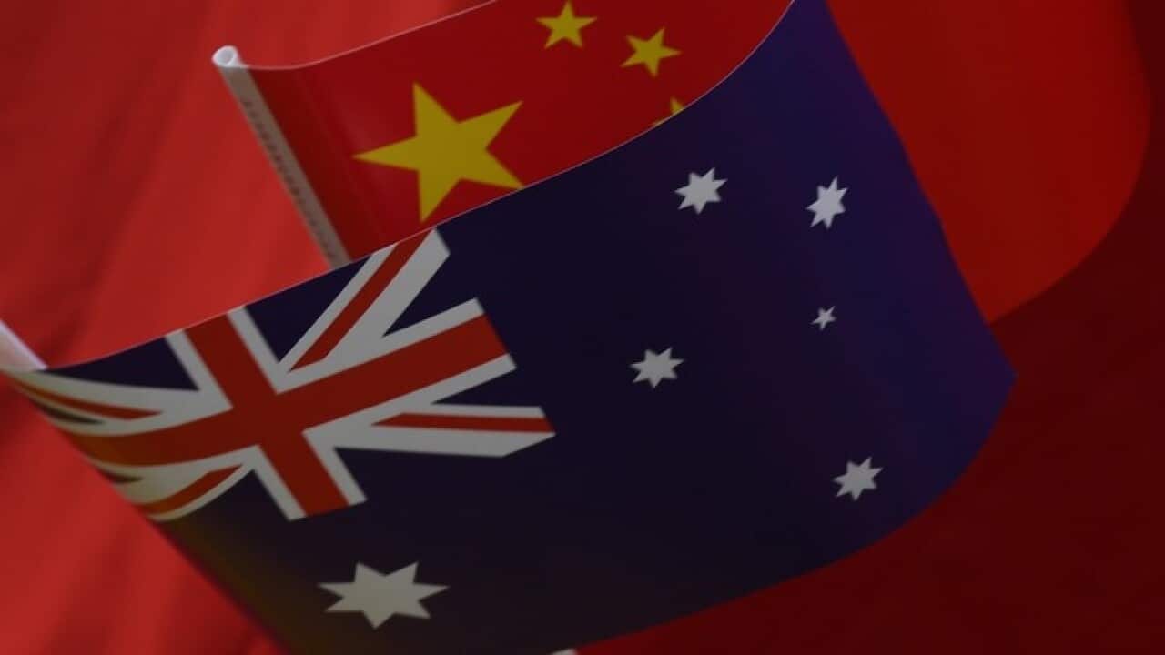 Flags of Australia and China.