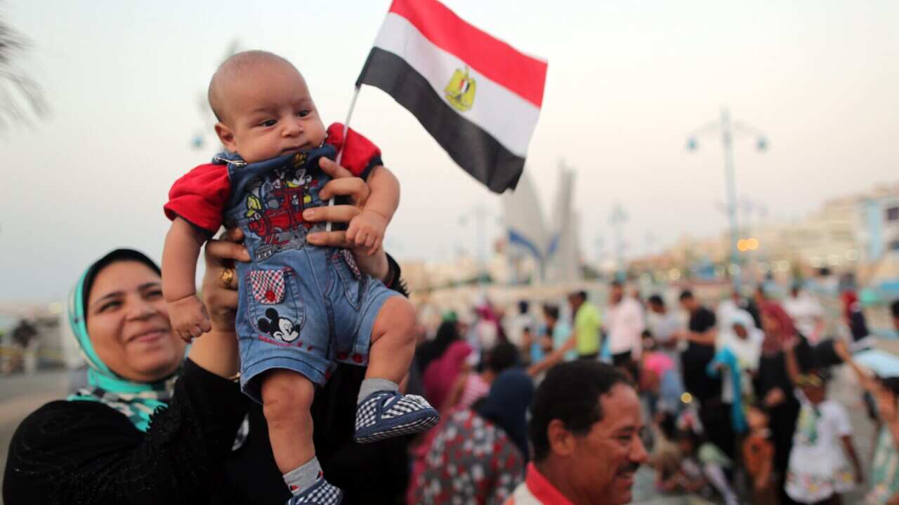 Egyptians celebrate the opening of the new addition to the Suez Canal, in Marsa Matruh, north west of Cairo, Egypt, 06 August 2015. (EPA/KHALED ELFIQI)