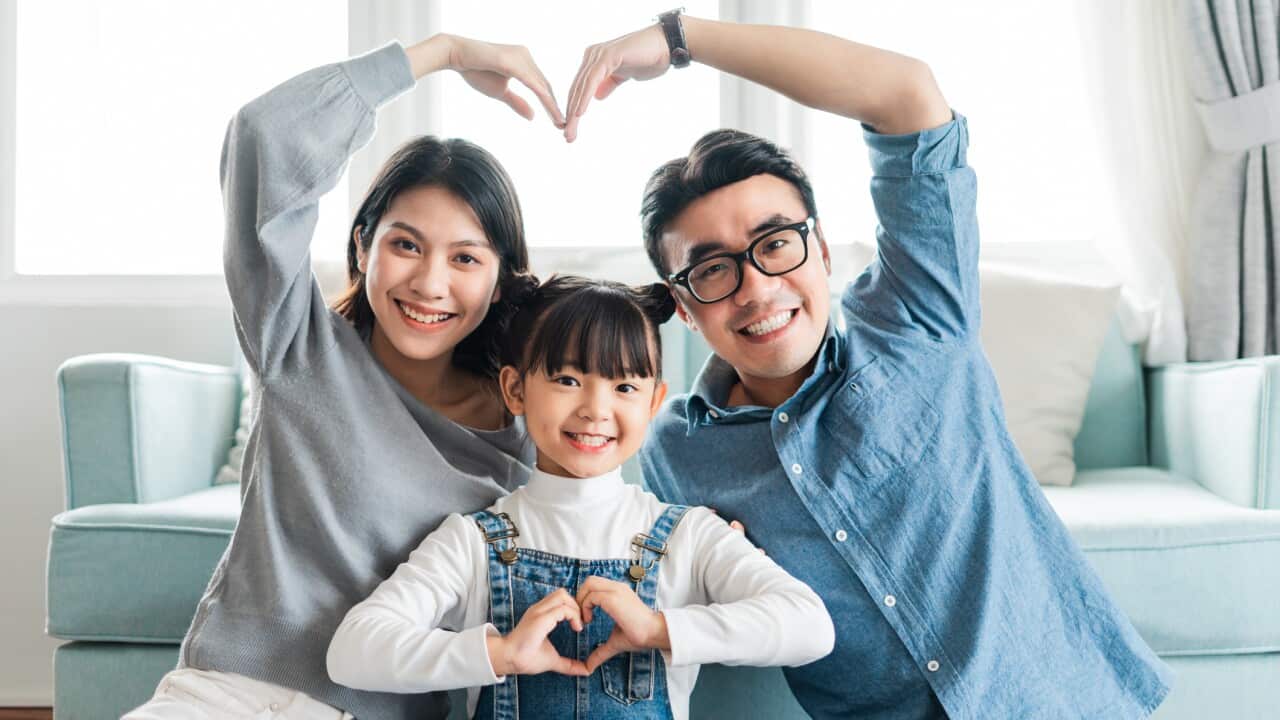 small asian family portrait at home