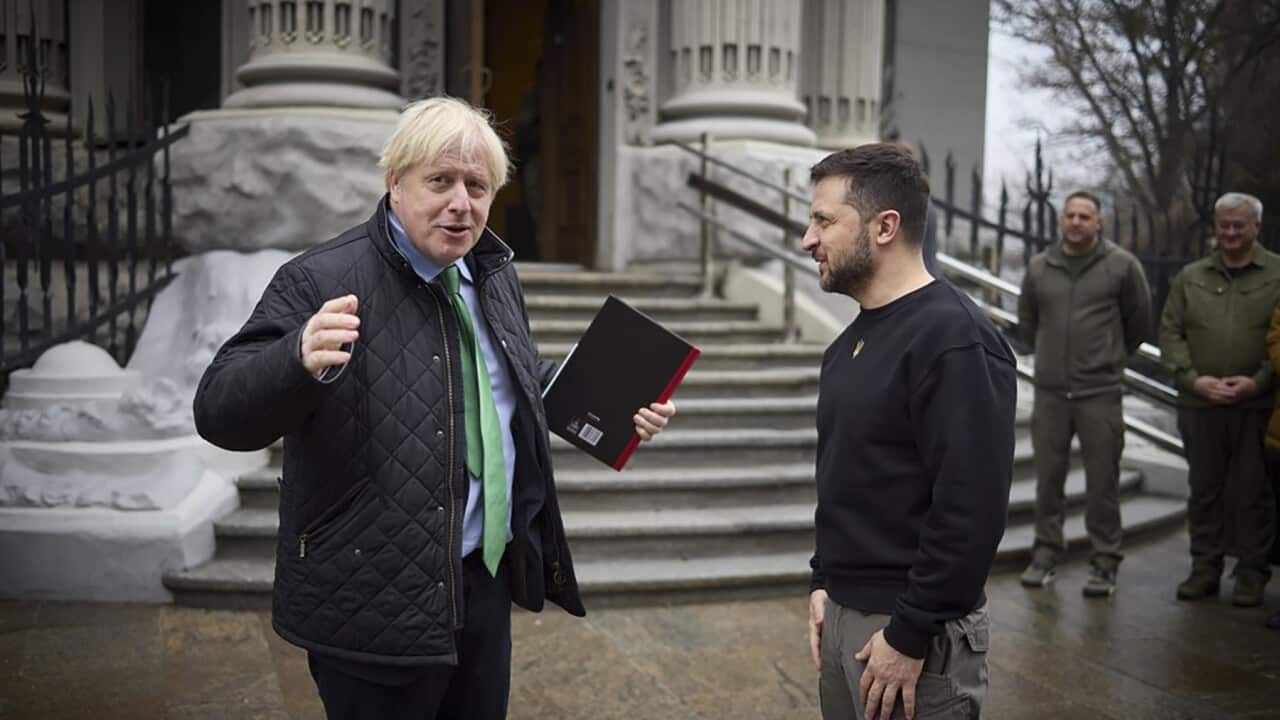 Ukrainian President Volodymyr Zelenskyy, right, and former British PM Boris Johnson talk during their meeting in Kyiv