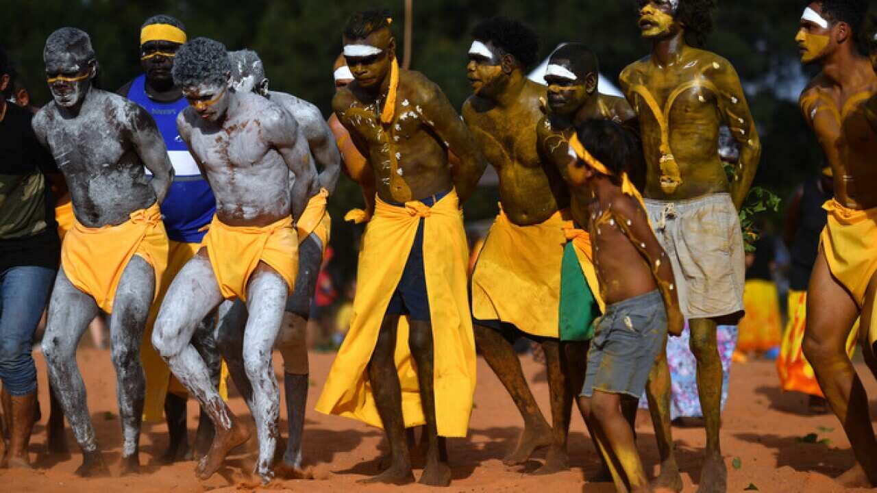 Yolngu people from north-eastern Arnhem Land perform the Bunggul traditional dance during the Garma Festival