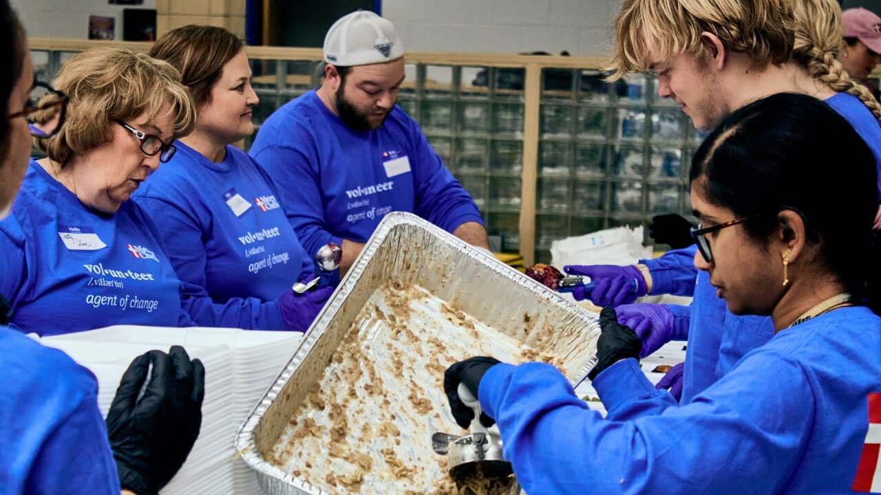 Local volunteers package meals prepared by Mercy Chefs at an emergency centre in Kentucky (AAP)