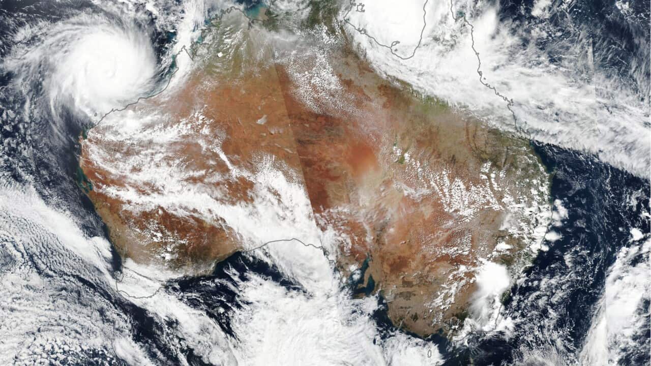 A satellite of two tropical cyclones