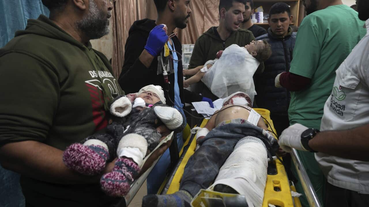 Bandaged children on stretchers