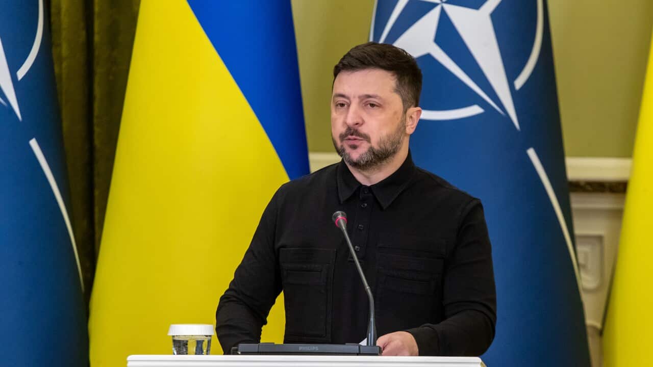 A man speaks at a podium
