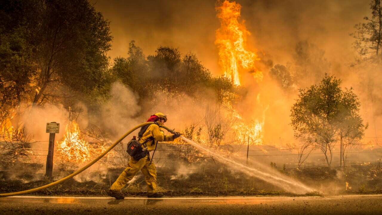 Scorching heat, winds and dry conditions complicated firefighting efforts. 