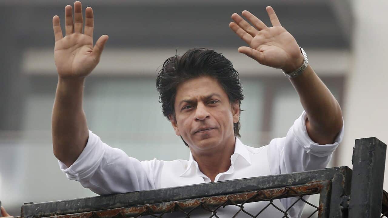 Bollywood actor Shah Rukh Khan greets fans waiting outside his residence on Eid al-Fitr in Mumbai, India.