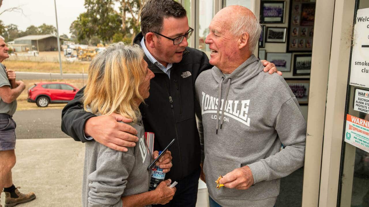 Vic Premier Daniel Andrews with a couple who lost their business in the fires in East Gippsland