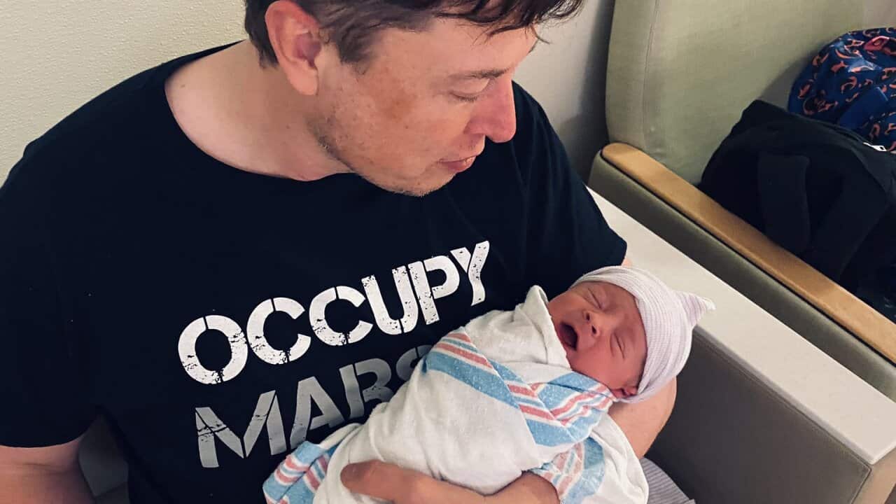 Elon Musk with his newborn