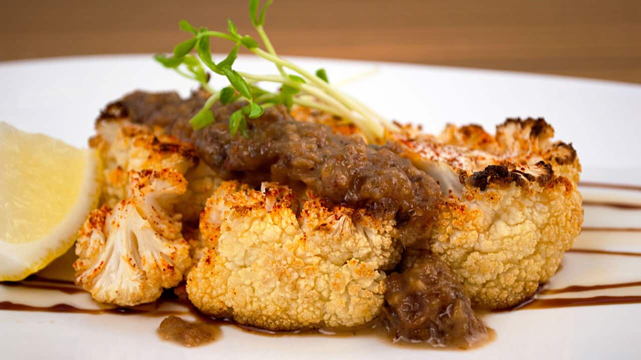Cauliflower steaks with raisin-caper sauce