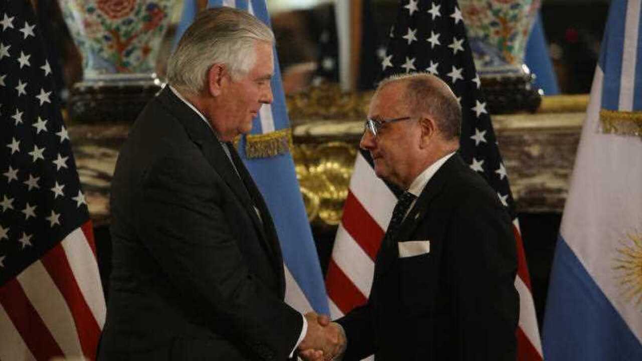 U.S. Secretary of State Rex Tillerson, left, and Argentine Foreign Minister Jorge Faurie shake hands after giving joint news conference in Buenos Aires, Argentina, Sunday