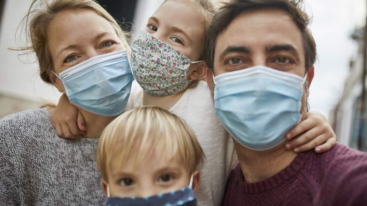 Real Family Taking a Selfie Together While Wearing Protective Face Masks