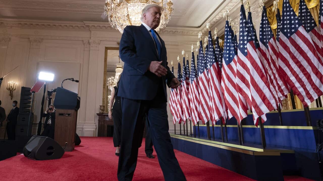 US President Donald Trump departs after making a statement to the nation