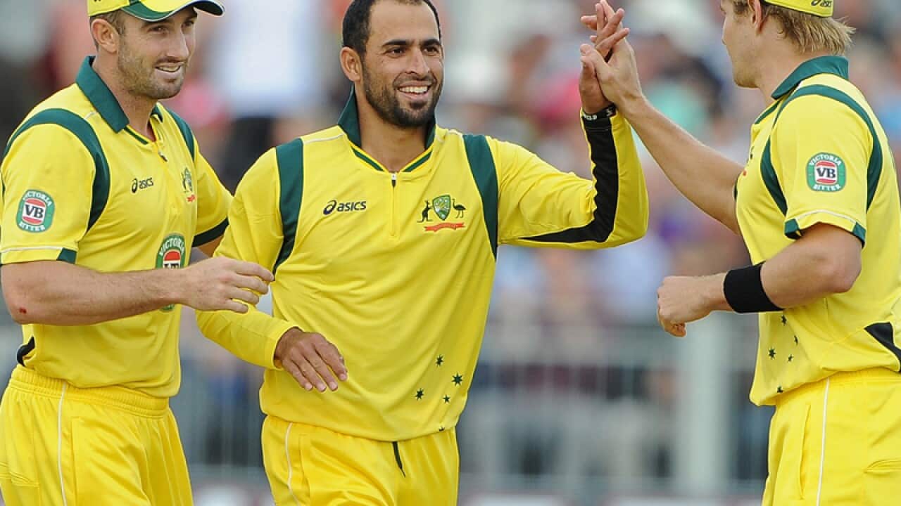 Former Pakistani refugee Fawad Ahmed (C)