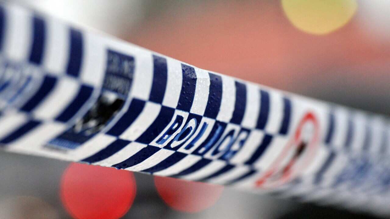 Police tape restricts access to a crime scene north of Sydney