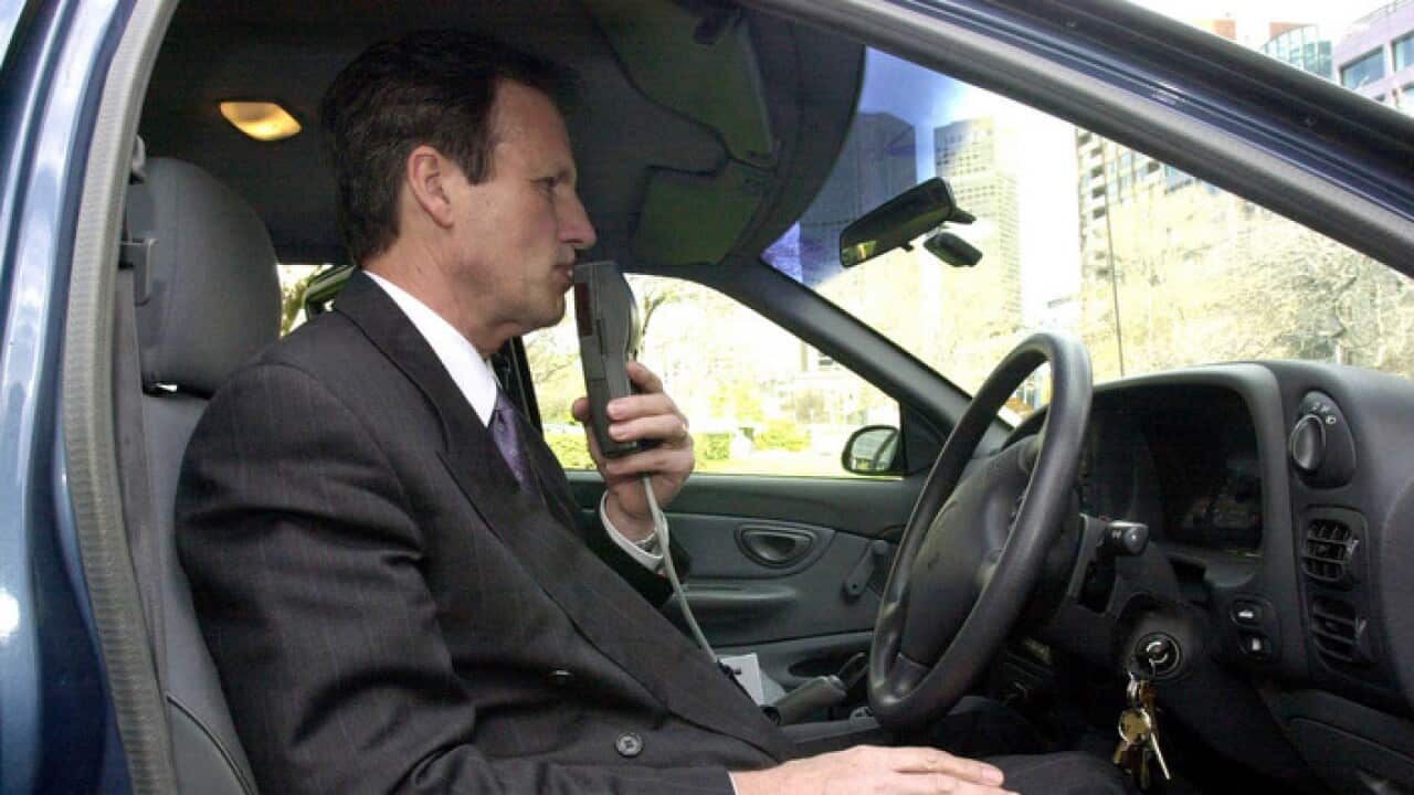 Co-developer of the alcohol ignition interlock device Rod Tatersall illustrates its use