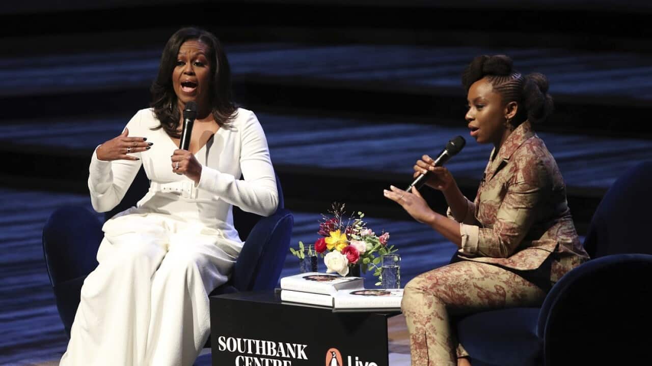 Michelle Obama, left, in conversation with writer Chimamanda Ngozi Adichie at the Royal Festival Hall, during her visit to the UK to publicist her memoir "Becoming", in London, Monday, Dec. 3, 2018. (Yui Mok/PA via AP)