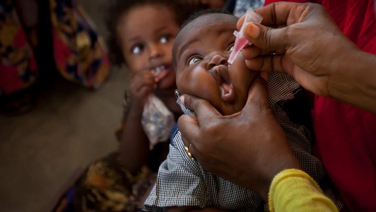 A Somali baby receives a polio vaccine at the Medina Maternal Child Health center in Mogadishu, Somalia in 2013.