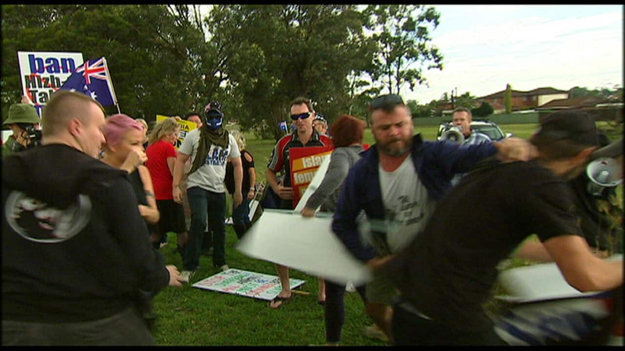Protesters outside a halal convention. (SBS)